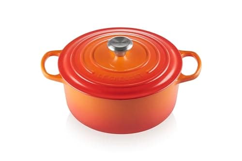 Flame orange Le Creuset Signature round Dutch oven with the lid on