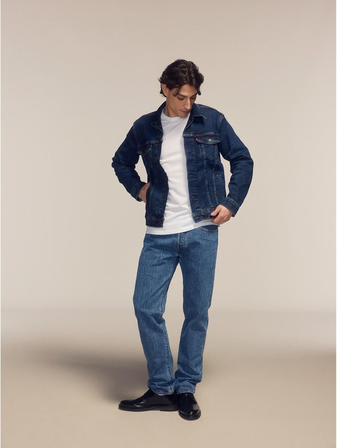Person wearing medium stonewash Levi's 501 Original Fit jeans