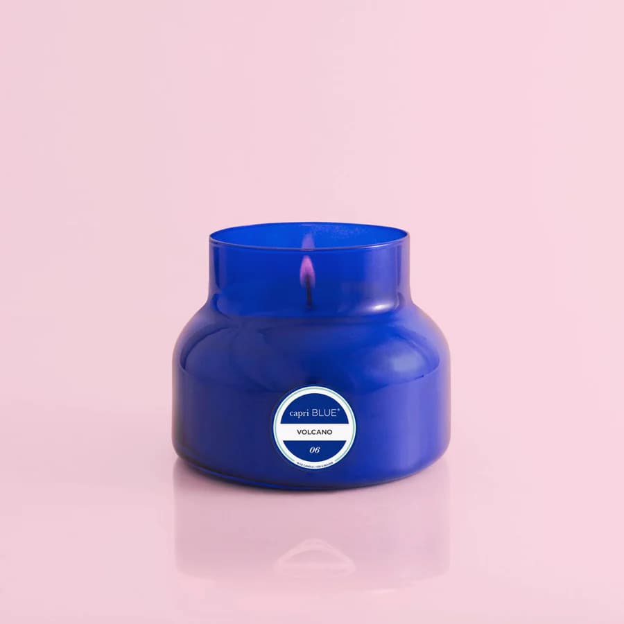 Capri Blue Volcano signature candle in a cobalt blue glass jar with a silver lid