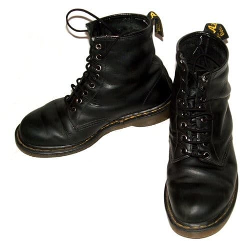 Pair of black Dr. Martens 1460 eight-eye boots with yellow welt stitching